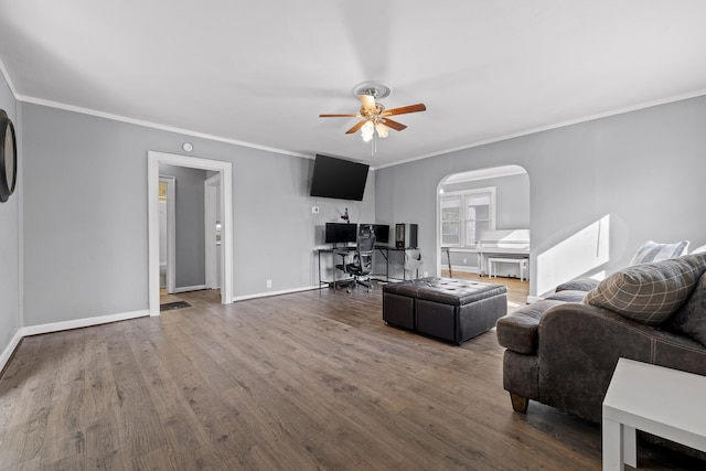 living room featuring hardwood / wood-style flooring, ornamental molding, and ceiling fan