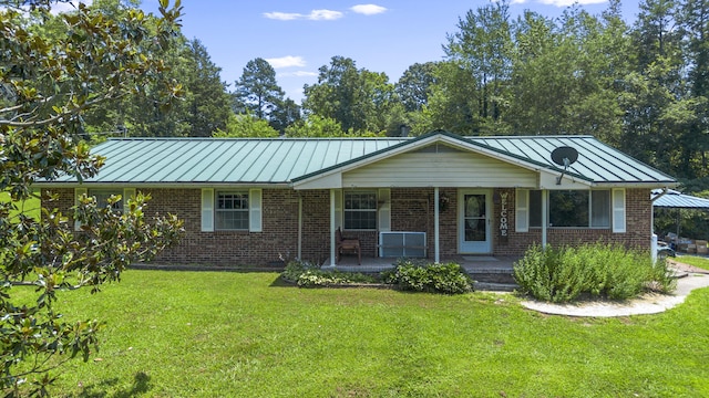 7209 Anthem Trl, Birchwood, TN 37308 - ranch-style home with a standing seam roof, brick siding, and a front lawn
