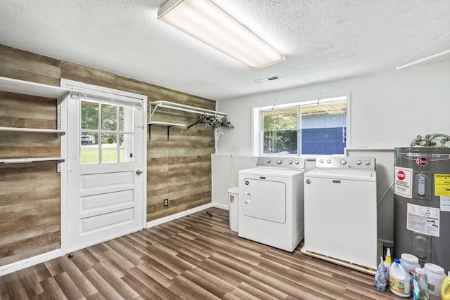 7209 Anthem Trl, Birchwood, TN 37308 - washroom with electric water heater, wooden walls, washing machine and clothes dryer, plenty of natural light, and a textured ceiling