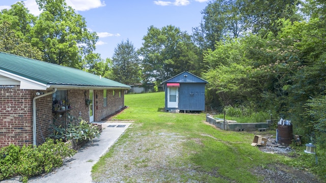 7209 Anthem Trl, Birchwood, TN 37308 - view of green lawn featuring a storage unit