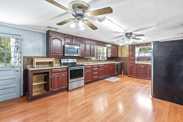7209 Anthem Trl, Birchwood, TN 37308 - kitchen featuring appliances with stainless steel finishes, plenty of natural light, ceiling fan, a textured ceiling, and crown molding