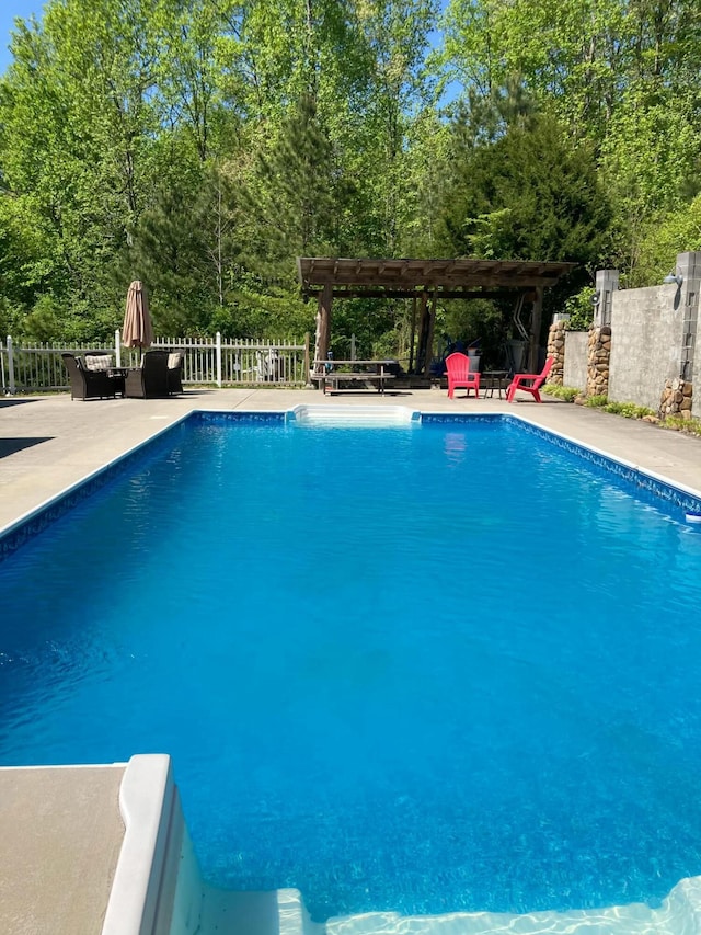 view of pool featuring a pergola and a patio area