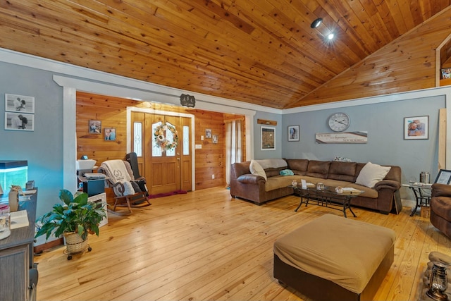 living room featuring lofted ceiling, light hardwood / wood-style floors, wooden ceiling, and wood walls