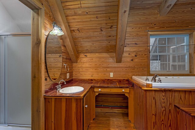 bathroom with vanity, lofted ceiling with beams, wooden ceiling, and wood walls