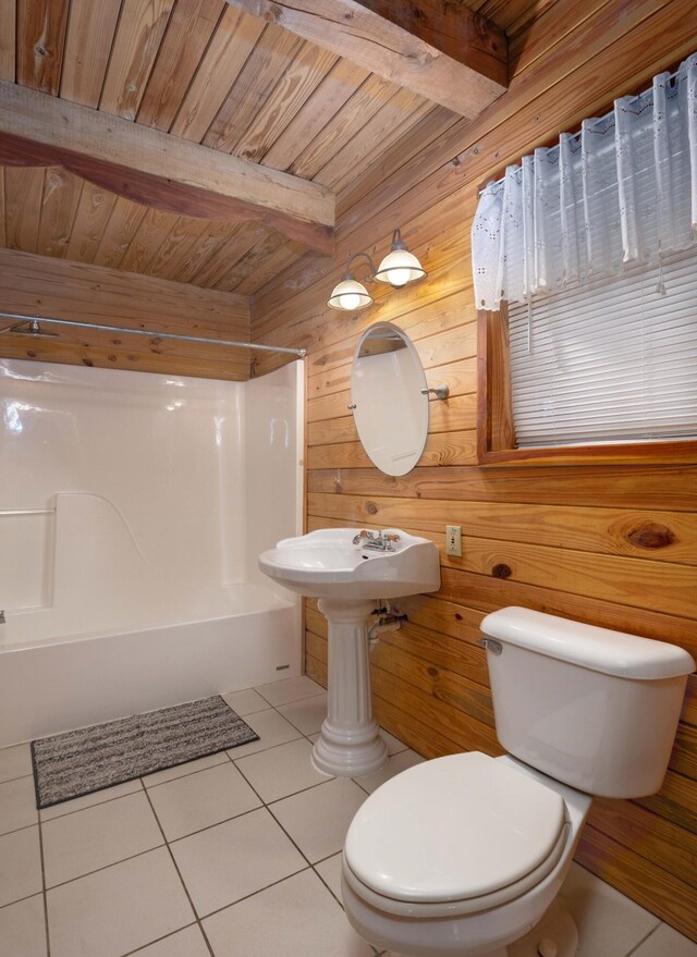 bathroom with tile patterned floors, beam ceiling, wooden ceiling, and wooden walls