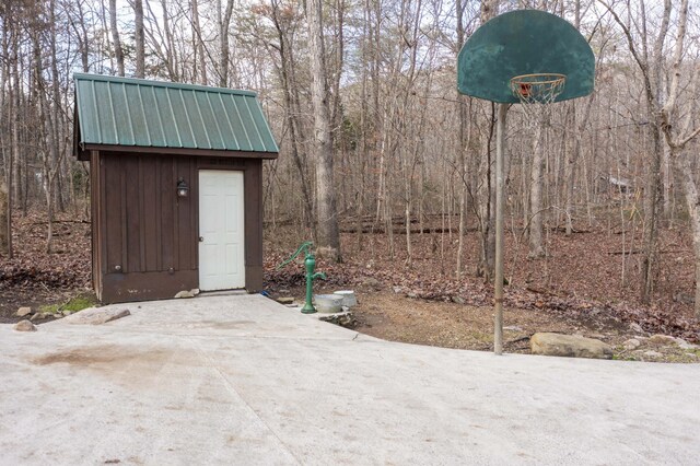 exterior space with a shed