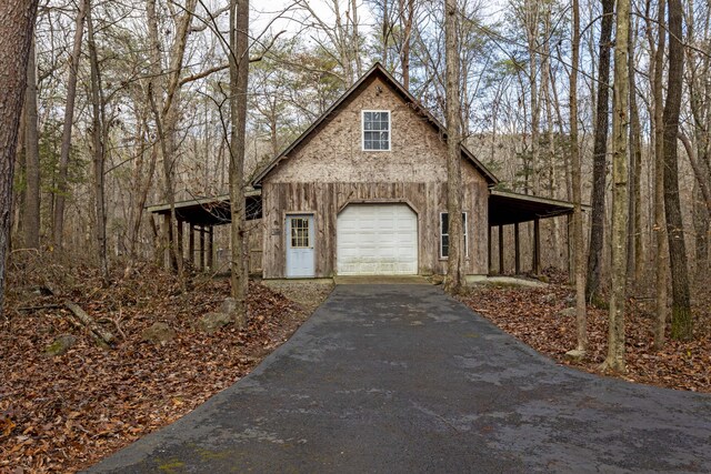 view of front of home featuring a carport and a garage