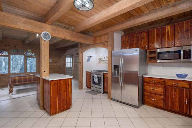 kitchen with wooden ceiling, decorative backsplash, light tile patterned floors, beam ceiling, and stainless steel appliances