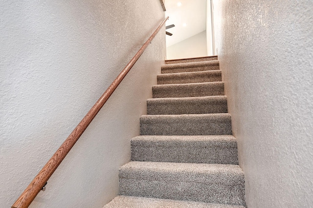 stairs with vaulted ceiling