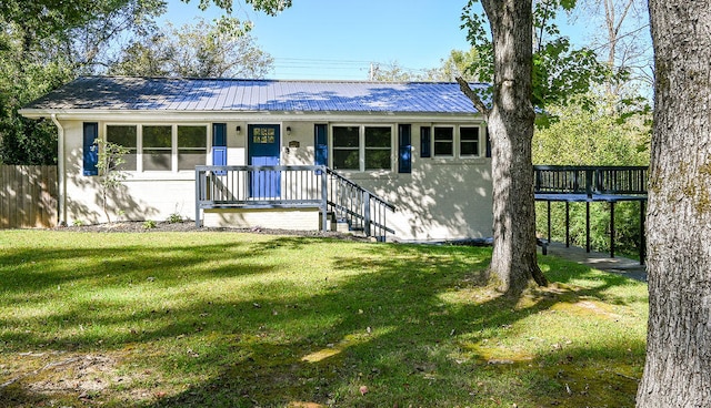 single story home with a front yard