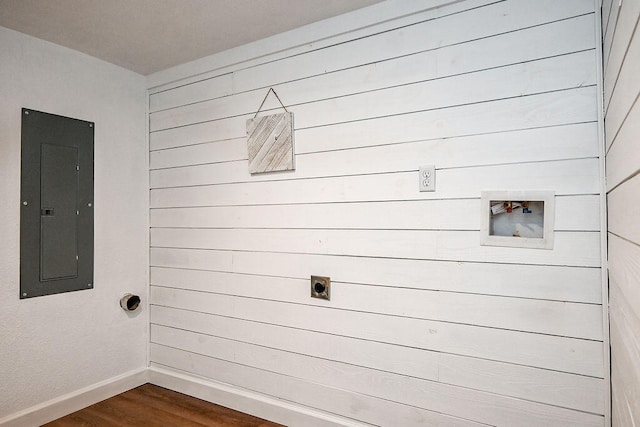 laundry area with electric dryer hookup, electric panel, dark hardwood / wood-style flooring, and washer hookup