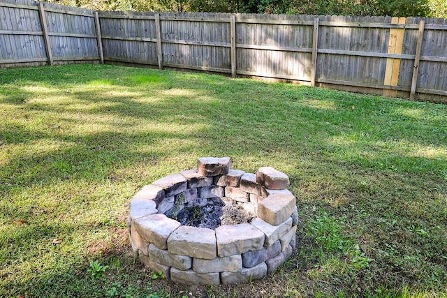 view of yard with a fire pit