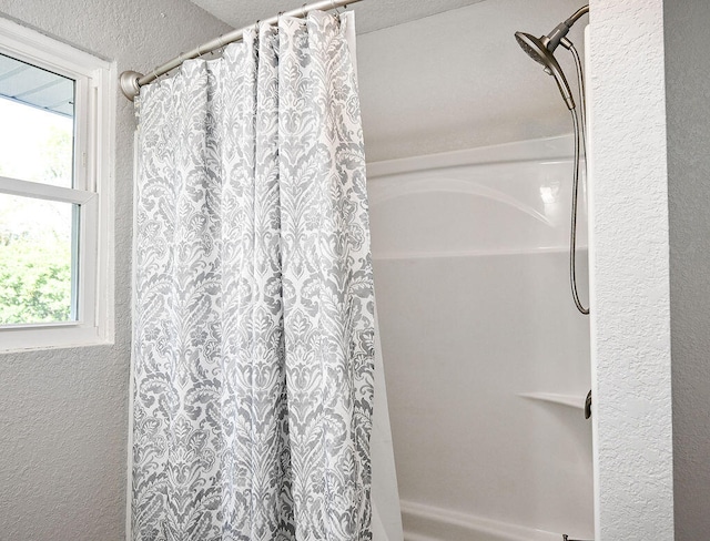 bathroom with curtained shower