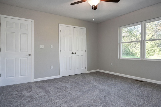 unfurnished bedroom featuring carpet flooring and ceiling fan