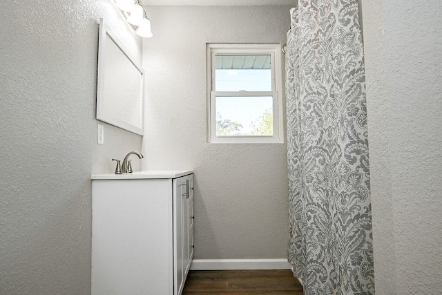 bathroom featuring hardwood / wood-style floors and vanity