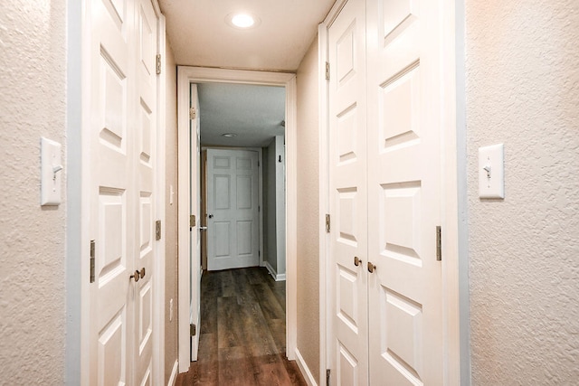 corridor featuring dark hardwood / wood-style flooring