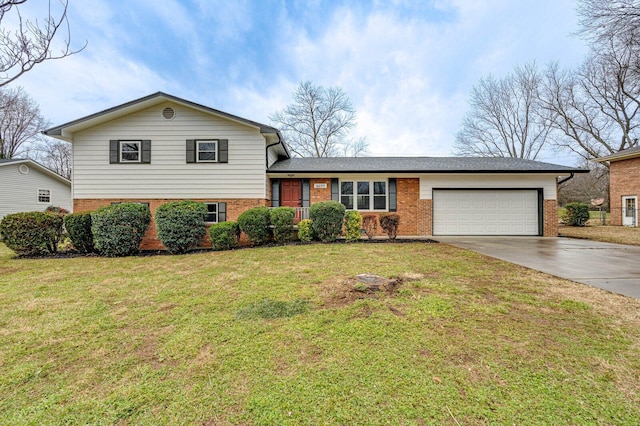 split level home featuring a garage and a front lawn