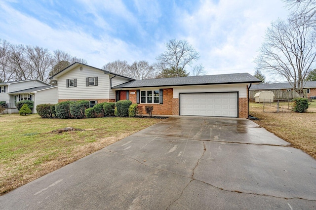 tri-level home featuring a garage and a front lawn