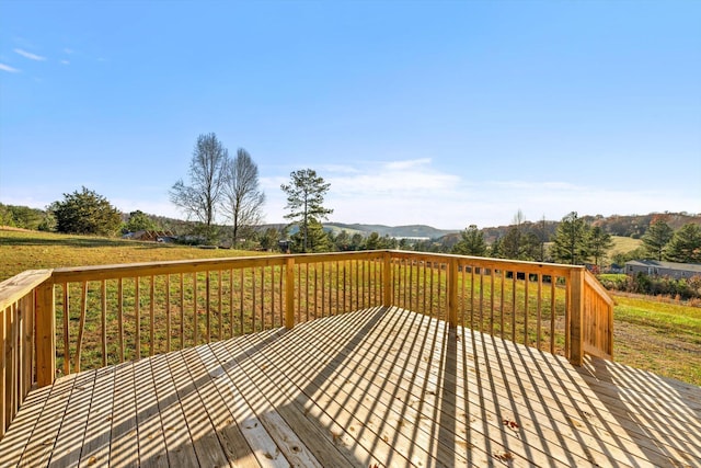 wooden terrace featuring a mountain view