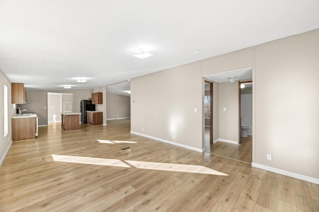 unfurnished living room featuring light hardwood / wood-style flooring