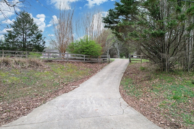 view of community featuring fence