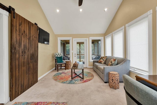 living room featuring recessed lighting, vaulted ceiling, light colored carpet, and a barn door