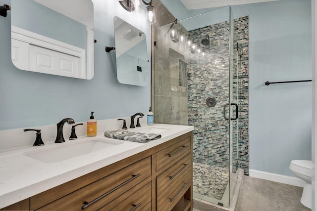 full bath featuring a shower stall, a sink, and toilet