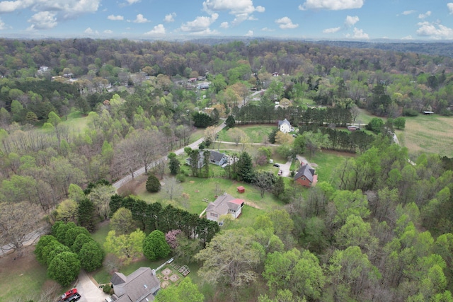 aerial view featuring a view of trees