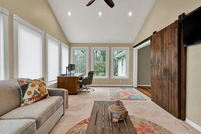 carpeted home office with ceiling fan, recessed lighting, a barn door, and vaulted ceiling