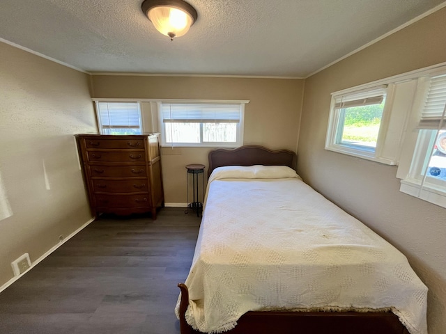 201 S Facy St, Rockwood, TN 37854 - bedroom featuring multiple windows, ornamental molding, baseboards, a textured ceiling, and dark wood-style floors