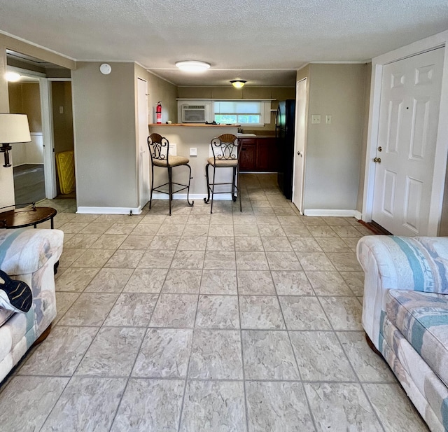 201 S Facy St, Rockwood, TN 37854 - living room featuring a textured ceiling and baseboards
