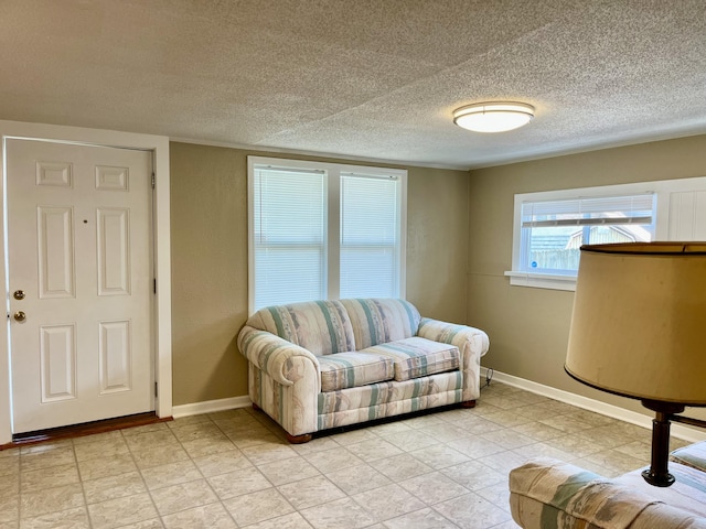 201 S Facy St, Rockwood, TN 37854 - living room with baseboards, a textured ceiling, and light tile patterned floors