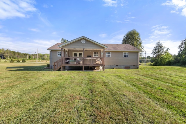 back of property with crawl space, a deck, and a yard