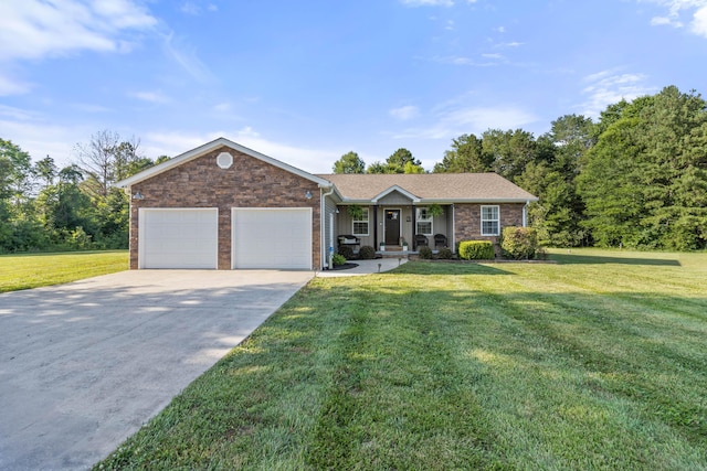 ranch-style house with an attached garage, a front lawn, concrete driveway, and brick siding