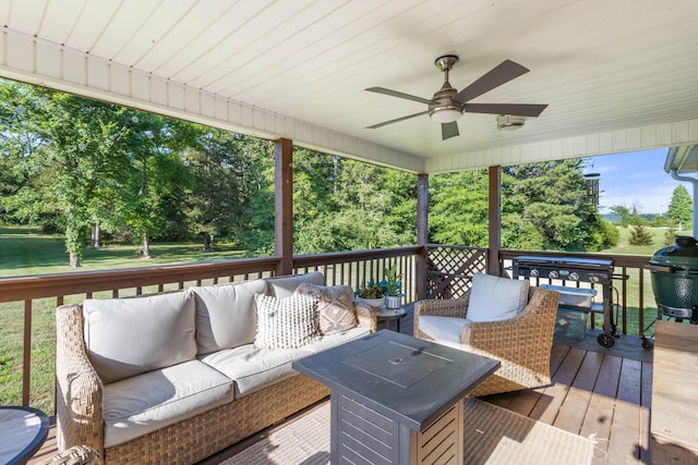 wooden deck with ceiling fan, an outdoor living space, and area for grilling