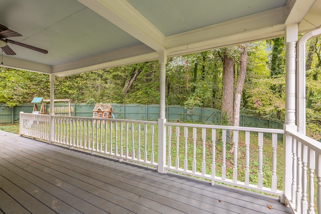 deck with a playground and ceiling fan