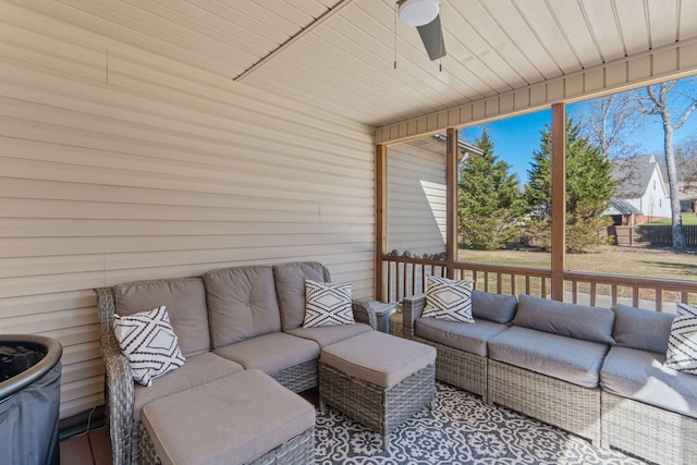 sunroom featuring ceiling fan
