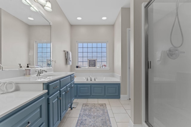 bathroom featuring a stall shower, a garden tub, a wealth of natural light, and tile patterned floors