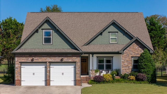 craftsman-style house with a front lawn