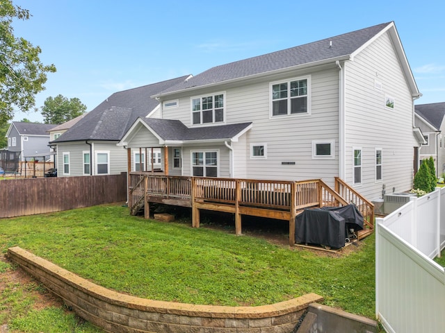 5013 Solar Ln NW, Cleveland, TN 37312 - back of house featuring a fenced backyard, a deck, and a shingled roof
