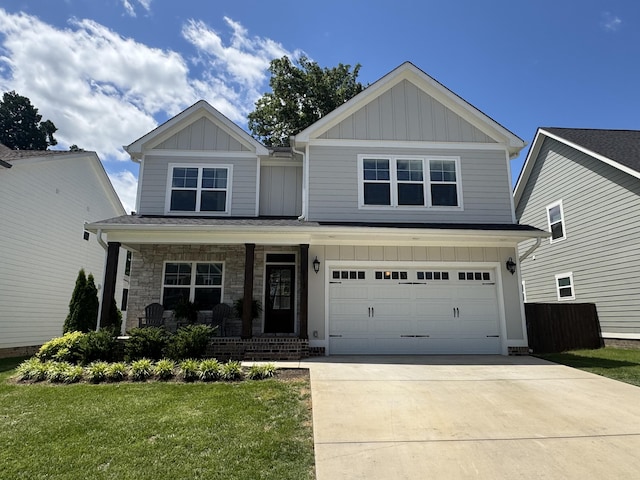 5013 Solar Ln NW, Cleveland, TN 37312 - craftsman-style home featuring board and batten siding, a porch, concrete driveway, and a front yard