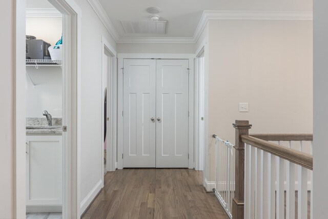 5013 Solar Ln NW, Cleveland, TN 37312 - hallway with wood finished floors, an upstairs landing, and ornamental molding