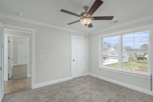 5013 Solar Ln NW, Cleveland, TN 37312 - unfurnished bedroom featuring carpet flooring, baseboards, crown molding, and a ceiling fan