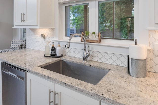 5013 Solar Ln NW, Cleveland, TN 37312 - kitchen with dishwasher, white cabinets, tasteful backsplash, and light stone countertops