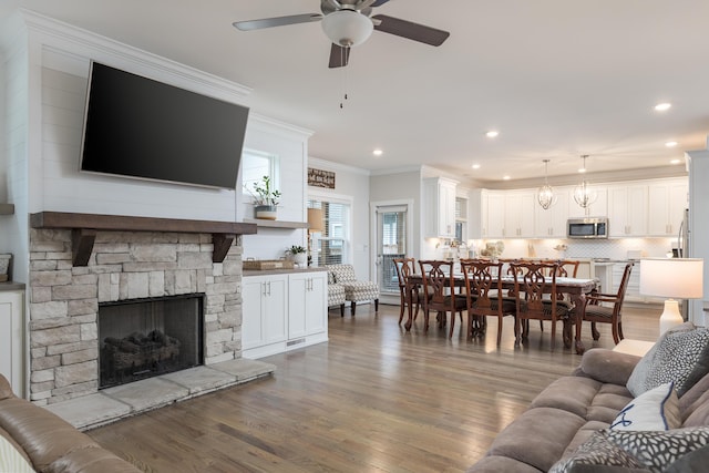 5013 Solar Ln NW, Cleveland, TN 37312 - living area with ceiling fan, wood finished floors, crown molding, recessed lighting, and a fireplace