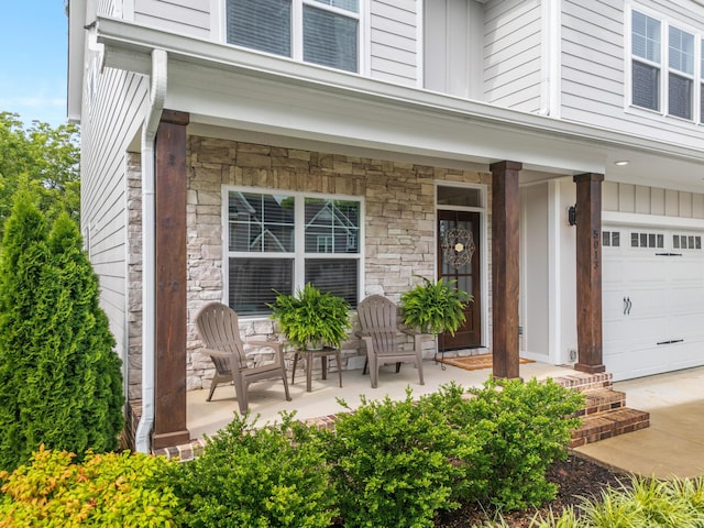 5013 Solar Ln NW, Cleveland, TN 37312 - property entrance featuring stone siding, a porch, and an attached garage