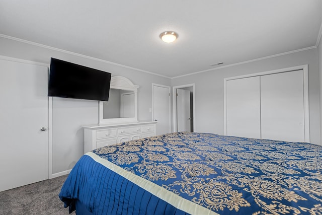 carpeted bedroom featuring a closet and crown molding