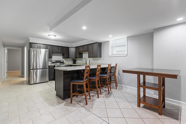 kitchen with stainless steel appliances, kitchen peninsula, light stone counters, crown molding, and a breakfast bar area