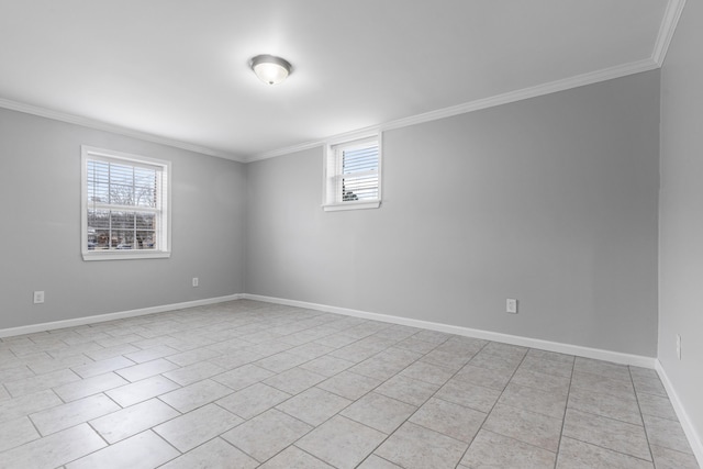 tiled empty room with a wealth of natural light and crown molding