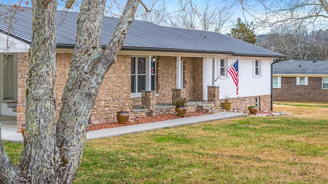 view of front of house with a front lawn and a porch